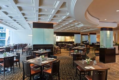 Well-arranged tables in White rose cafe at York Hotel Singapore