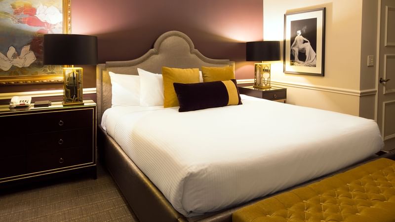 Cozy bed with side tables in Follie Suite at Warwick New York