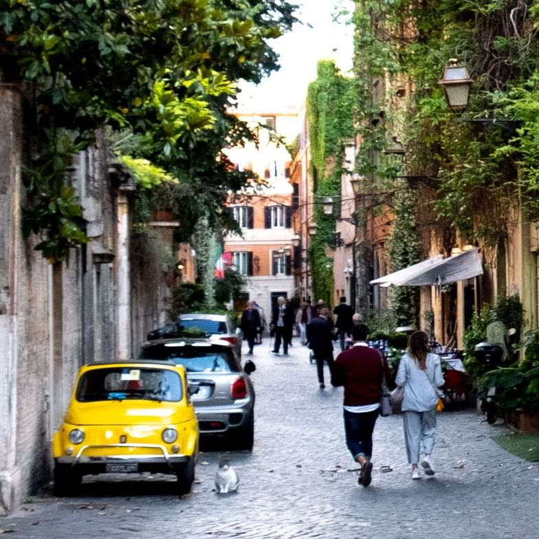 The city streets with people near Rome Luxury Suites