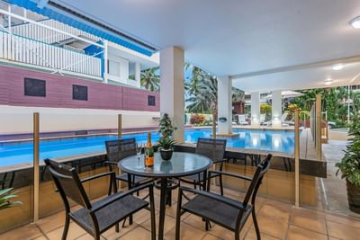 Table by the outdoor pool, Silkari Reflections Of Port Douglas
