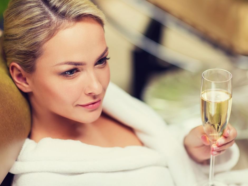 Woman drinking a glass of champagne