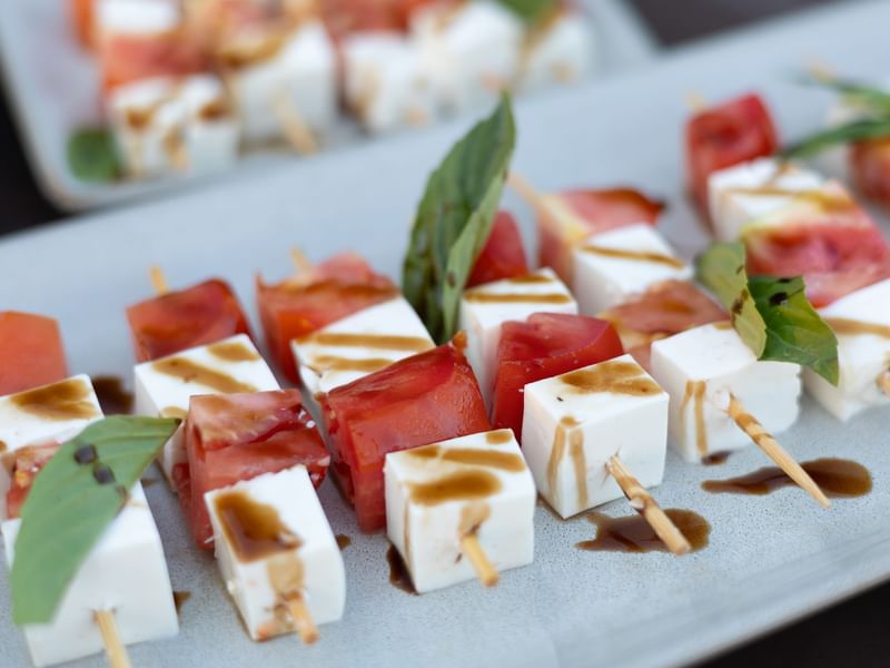 Cubed cheese and tomato skewers drizzled with balsamic sauce at Riviera Nayarit Resort & Spa.