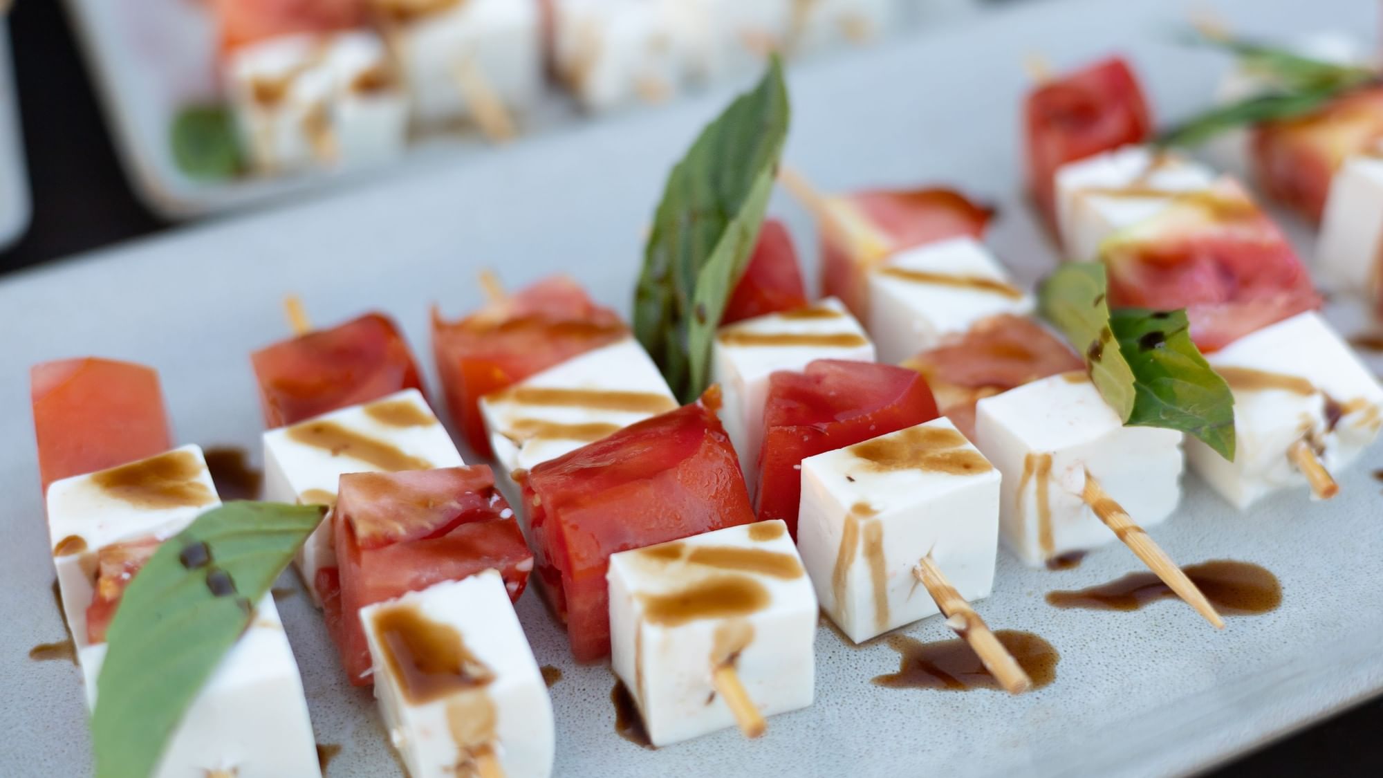 Cubed cheese and tomato skewers drizzled with balsamic sauce at Riviera Nayarit Resort & Spa.