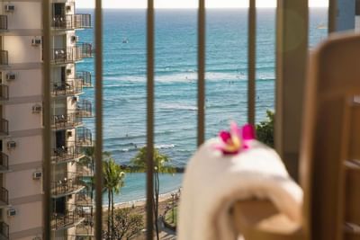 View of the ocean through balcony railings at Waikiki Resort Hotel by Sono