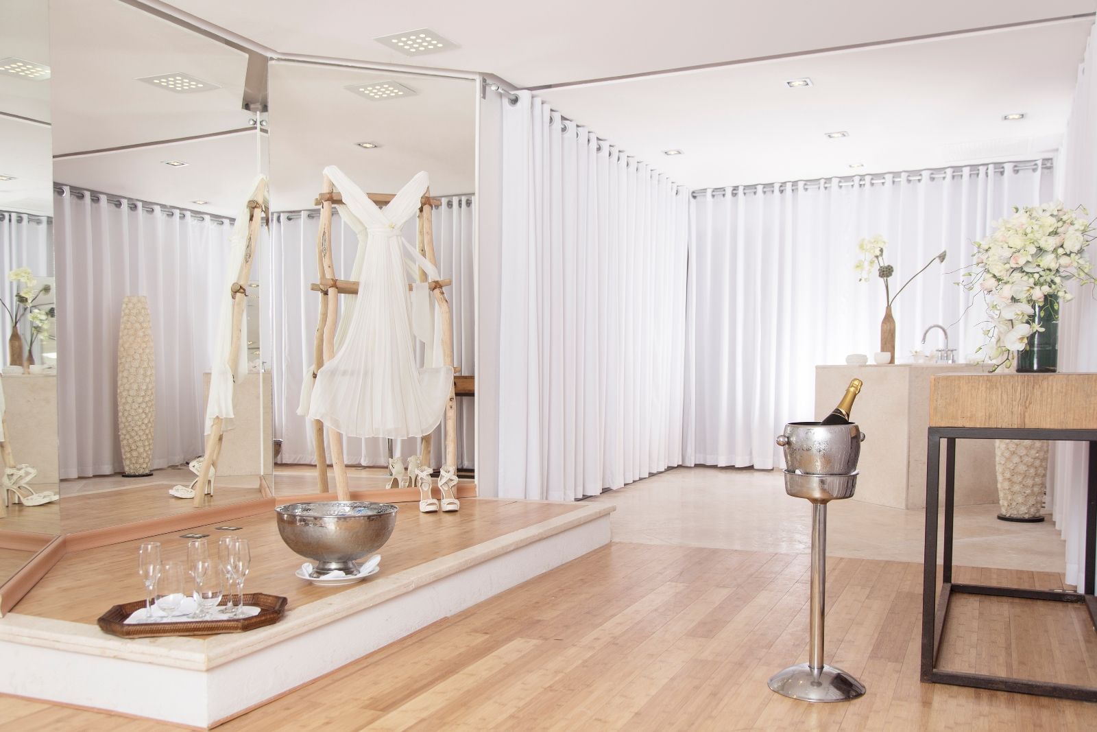 a wedding dress and drinks in a room