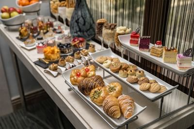 Continental breakfast table with cakes at Elaf Al Taqwa