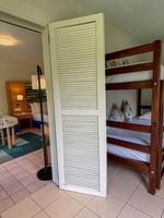 Bunk beds and a twin bed in Superior Garden View Room at The Naviti Resort - Fiji Korolevu.