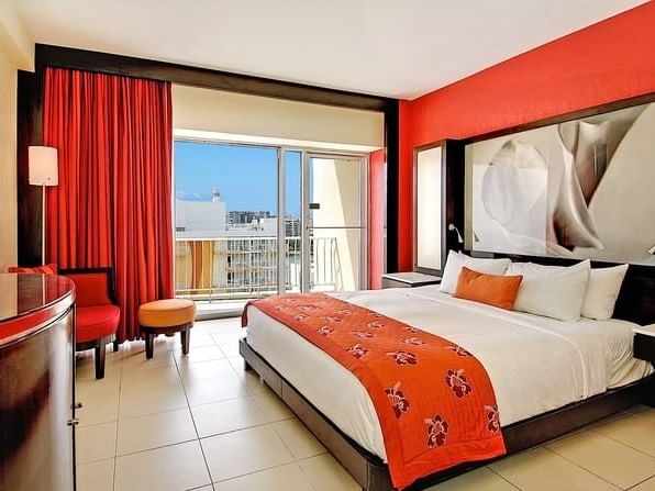 Oceanfront Suite with a King bed near balcony at Condado Plaza
