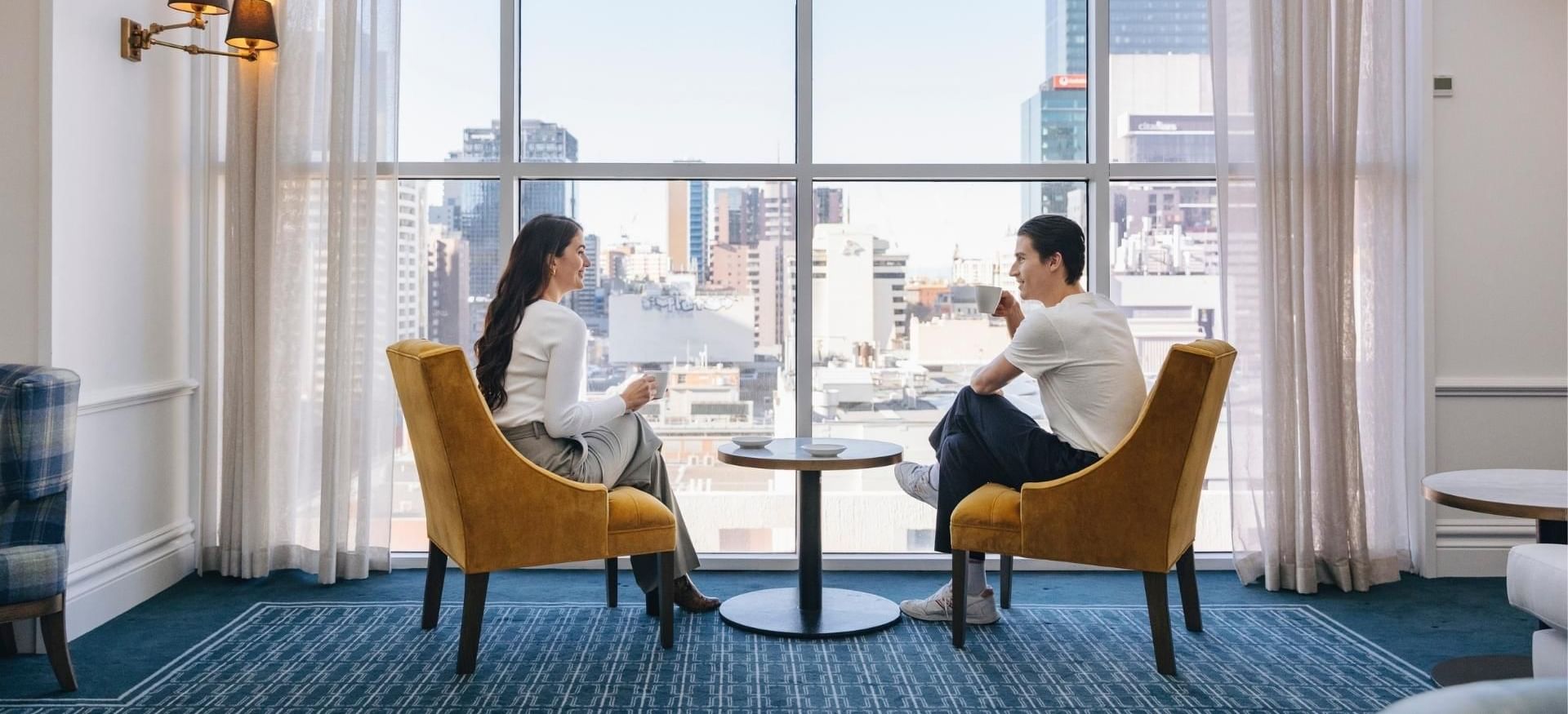 Couple in Elevate Club Lounge at Pullman Melbourne CBD