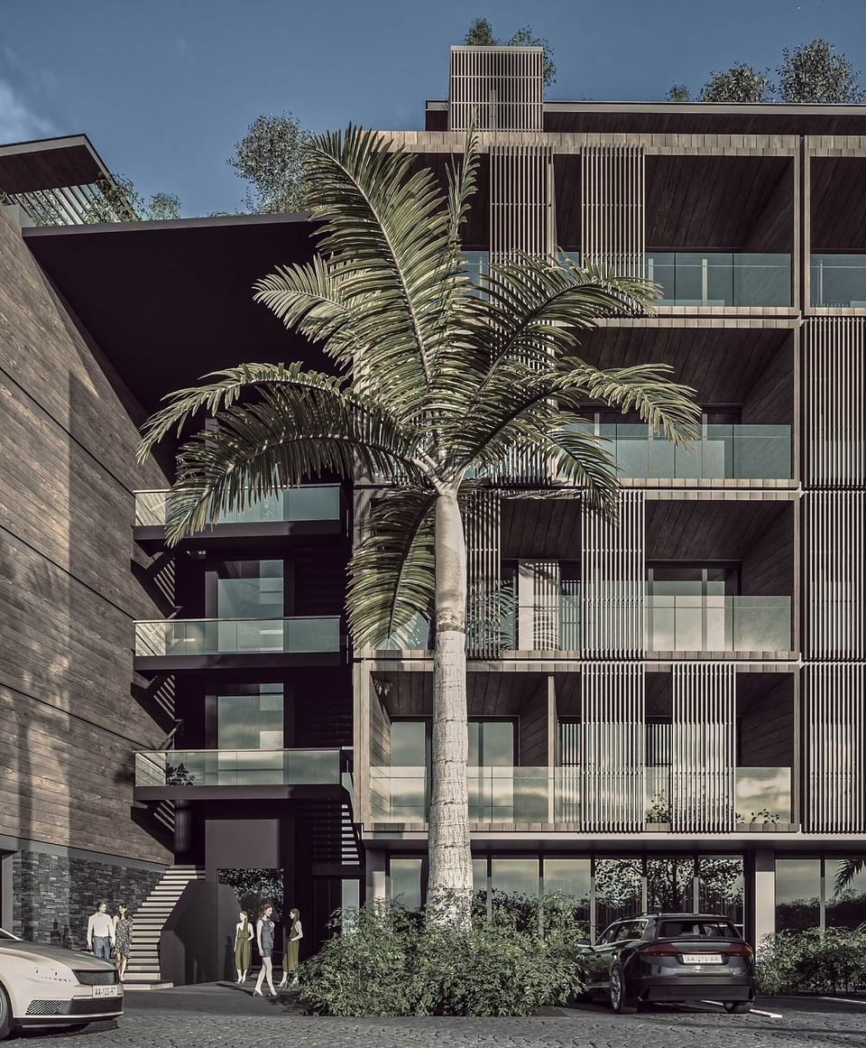 Modern multi-story Sunset Residence with a unique wood-and-glass facade and a parking lot at A'ila Residences
