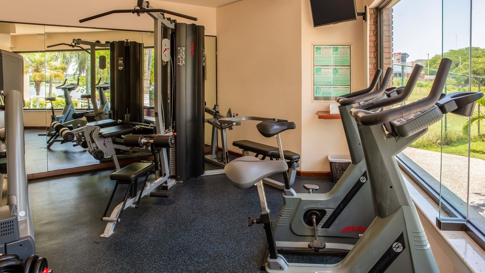 A well-equipped gym with machines at Fiesta Inn Tampico