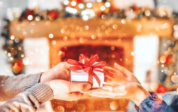 Loved ones giving each other Christmas gifts