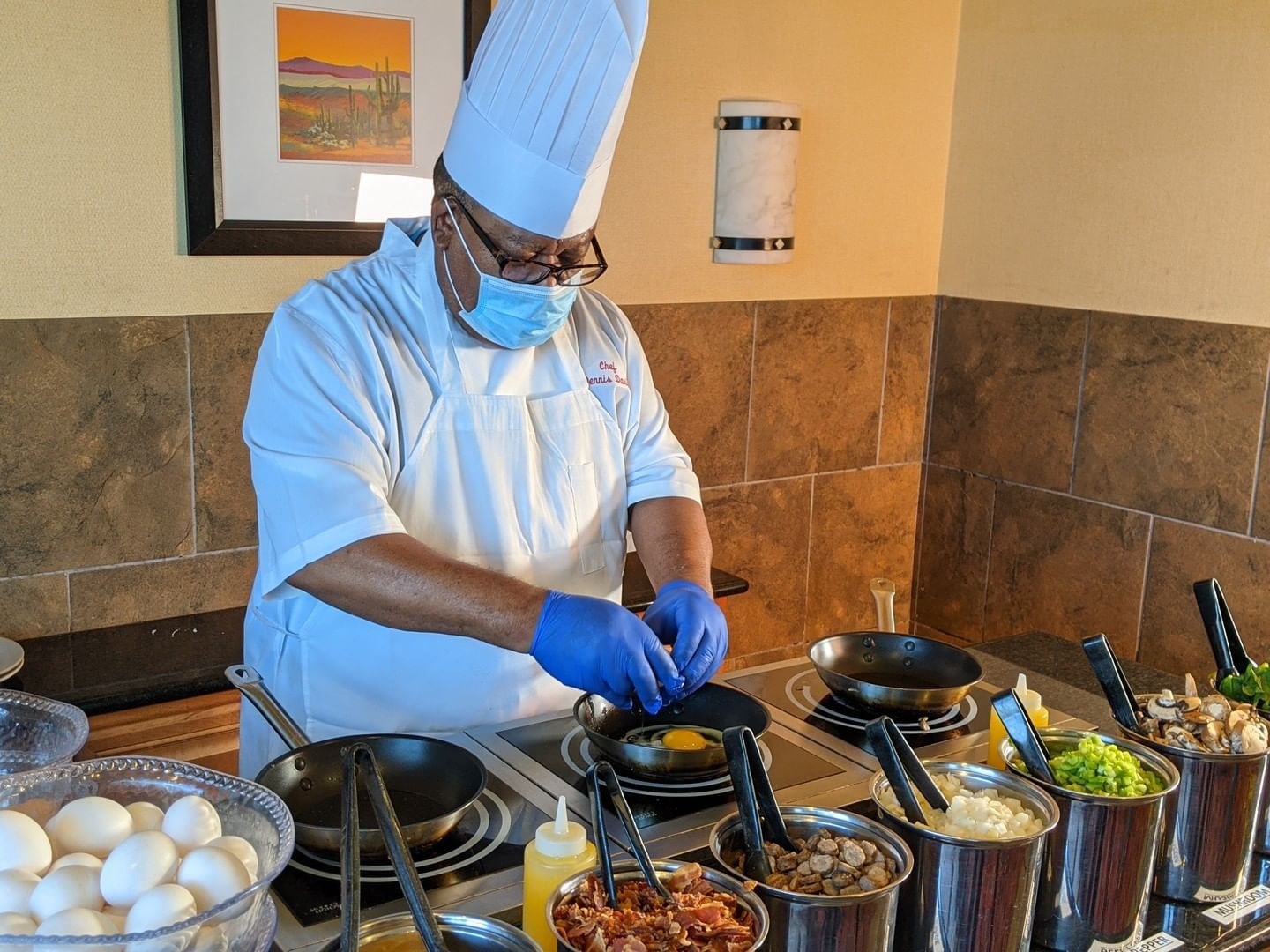 Closeup on a chef making a meal using eggs at MCM Hotel Lubbock