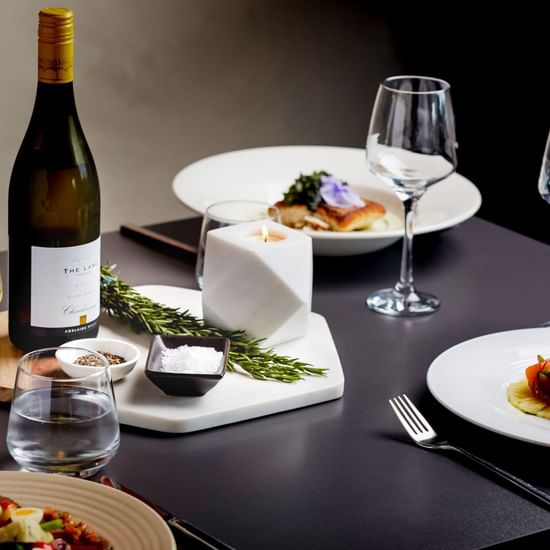 Meal plates and champagne glasses served at Pullman Albert Park