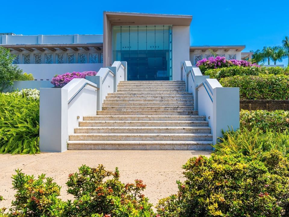 Flowers & bushes lined by the entrance stairway to Grand Atlantic Terrace at Las Casitas Village