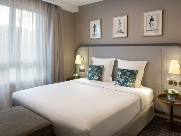 King bed of Premium Suite at Warwick Reine Astrid Lyon