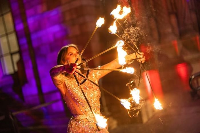 Christmas Parties Berkshire featuring the Fire based Christmas celebration with woman shooting bow with fire arrows