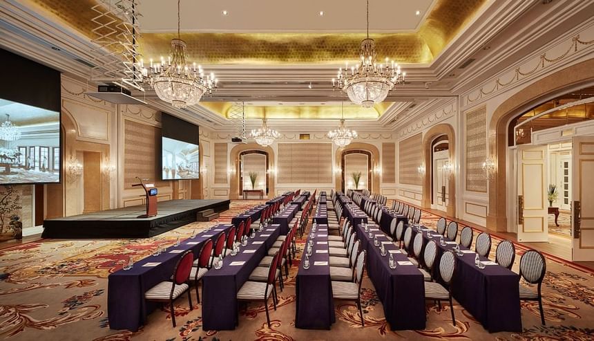 Classroom type arrangement in a Ballroom with an illuminated ceiling and carpeted floors at Park Hyatt Saigon