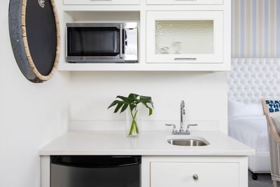 Kitchenette with pantry & appliances in King Premiere Palm at Retro Suites Hotel