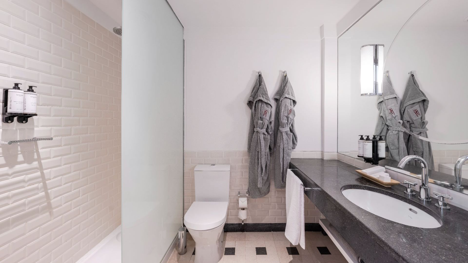Bathroom Vanity & bathrobes in a Room at Bensaude Hotels