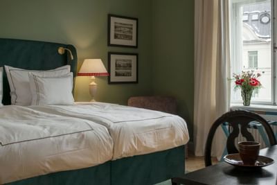 Bedroom arrangement in Superior Twin Room at The Sparrow Hotel