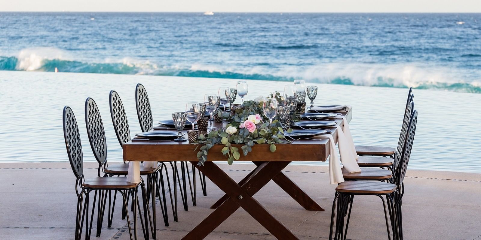 A banquet table on a beach near Marquis Los Cabos