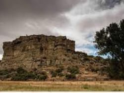 Low-angle view of Pompey's Pillar National Monument near Boothill Inn & Suites