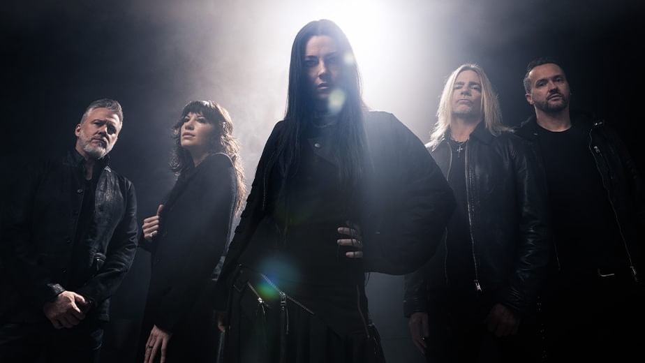 Five band members dressed in black stand dramatically backlit by bright stage lights for Evanescence World Tour 2027