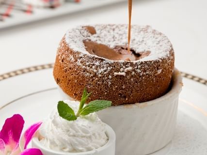 Cake in a small mug with whipped cream at Mission Inn Riverside