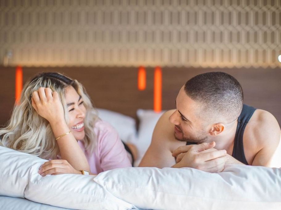 A couple spending time in a room at the Hotel Angeleno