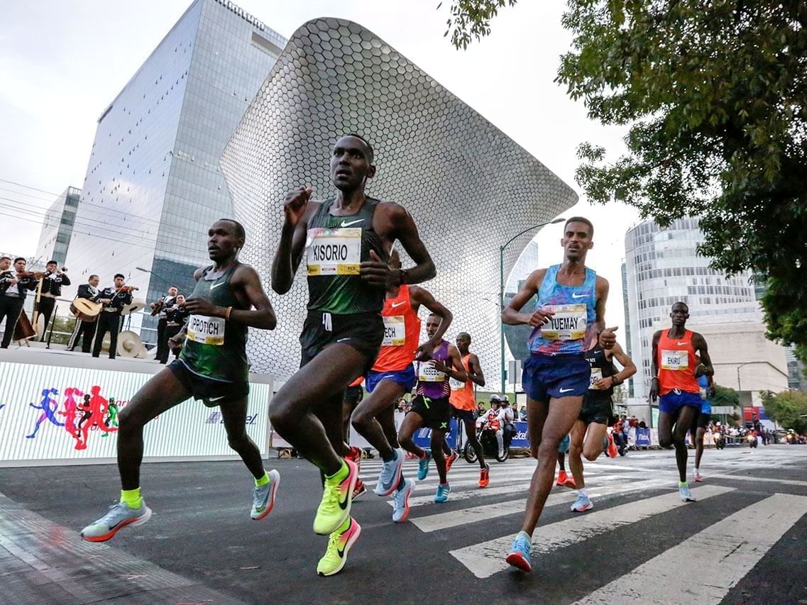 Athletes in a marathon, running on a street near Fiesta Inn