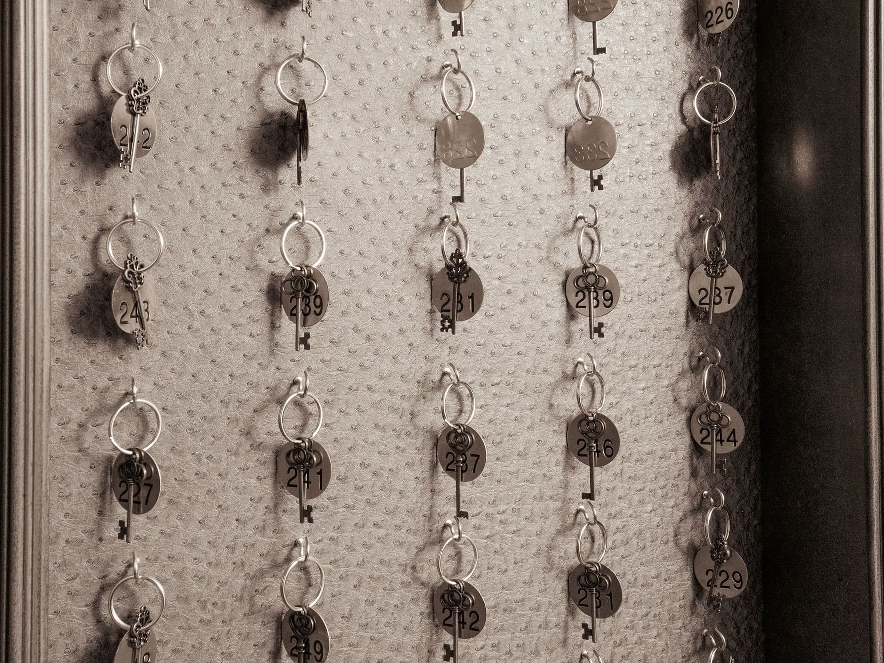 Close-up of Room keys hanging on a wall at Ivey's Hotel
