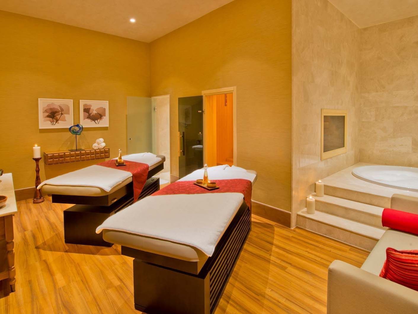 Two massage beds arranged by hot steam tub in BeFine Spa at Titanic Deluxe Lara