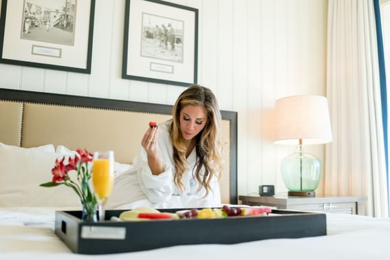 Lady having breakfast on bed at Beauport Hotel Gloucester