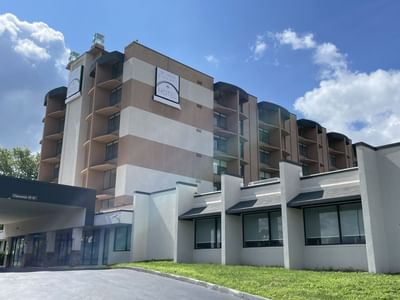 Low-angle view of hotel exterior with motor lobby at St. Louis Airport Hotel