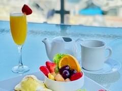 Eggs Bene and Mimosa on patio