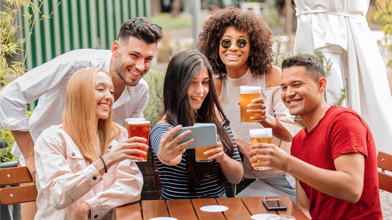 Group of friends enjoying beer at Kiwanis AleFest 2026.