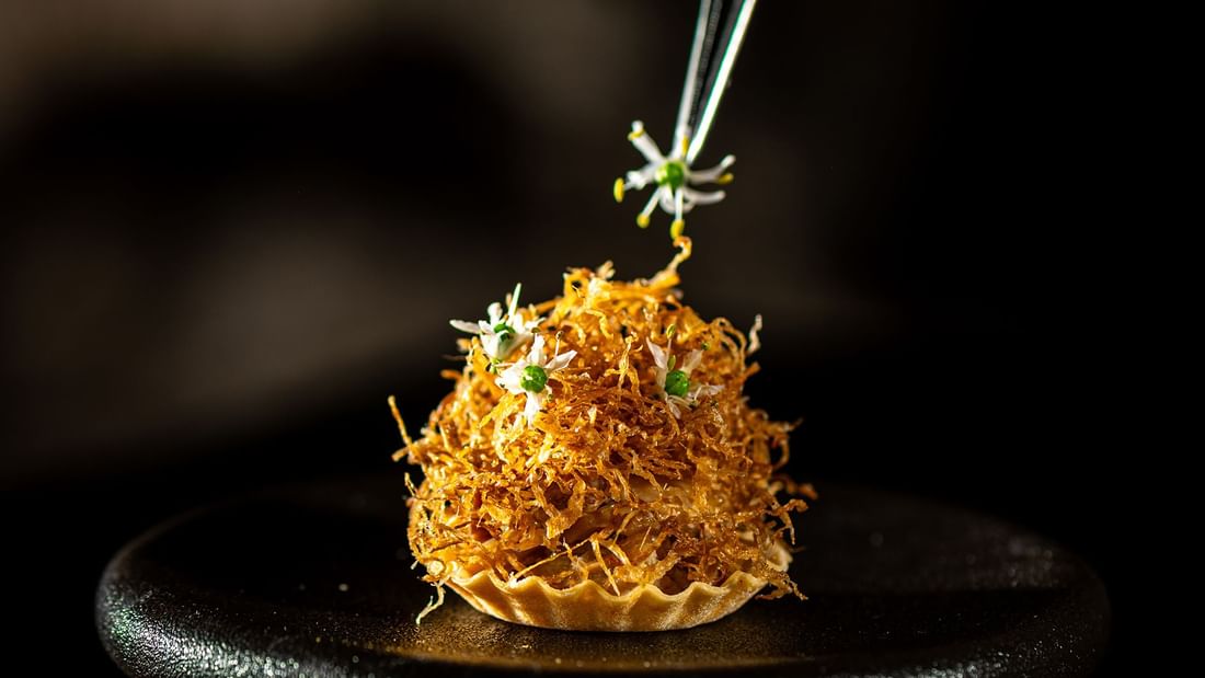 Close-up of an Aun Koh dish served in Jeff's Cellar at The Banjaran Hotsprings Retreat