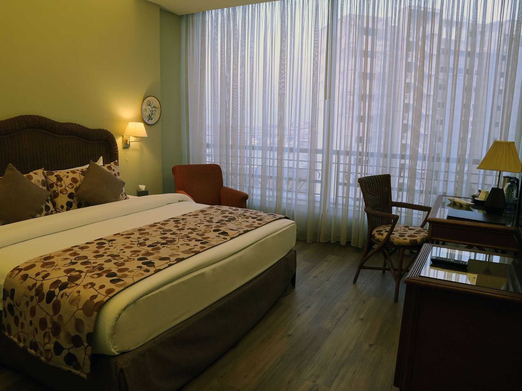Work desk facing the bed by the window in Classic Room at Warwick Palm Beach Hotel