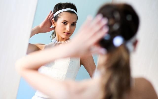 Bride gazing into mirror Turkish Wedding Tradition