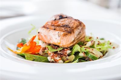 Close-up of fish and asparagus dish served in Accra Deck at Accra Beach Hotel & Spa