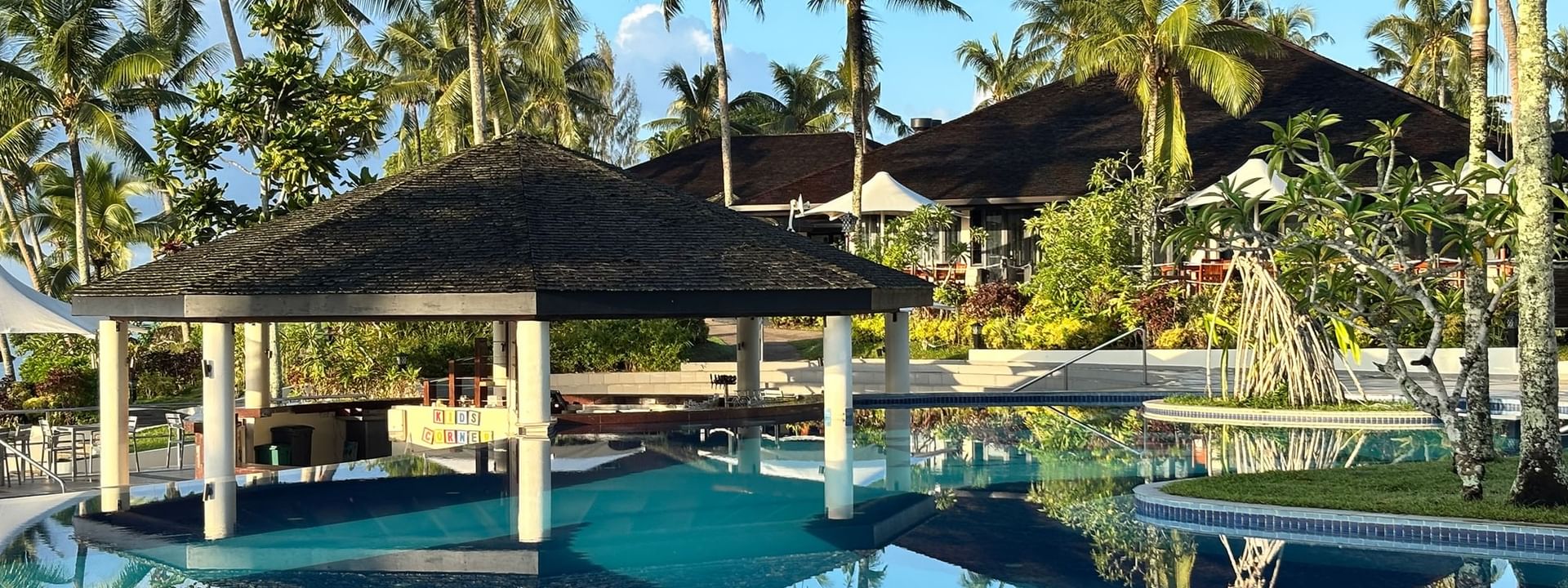 Clear pool and tropical surroundings with pavilion at Warwick Le Lagon Vanuatu in Efate