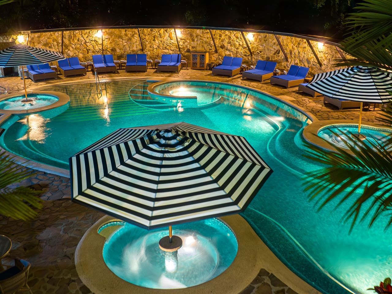 Outdoor pool area with sunbeds at Hideaway Rio Celeste