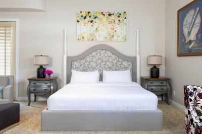 King bed, nightstands & cozy lounge in King Executive at Retro Suites Hotel