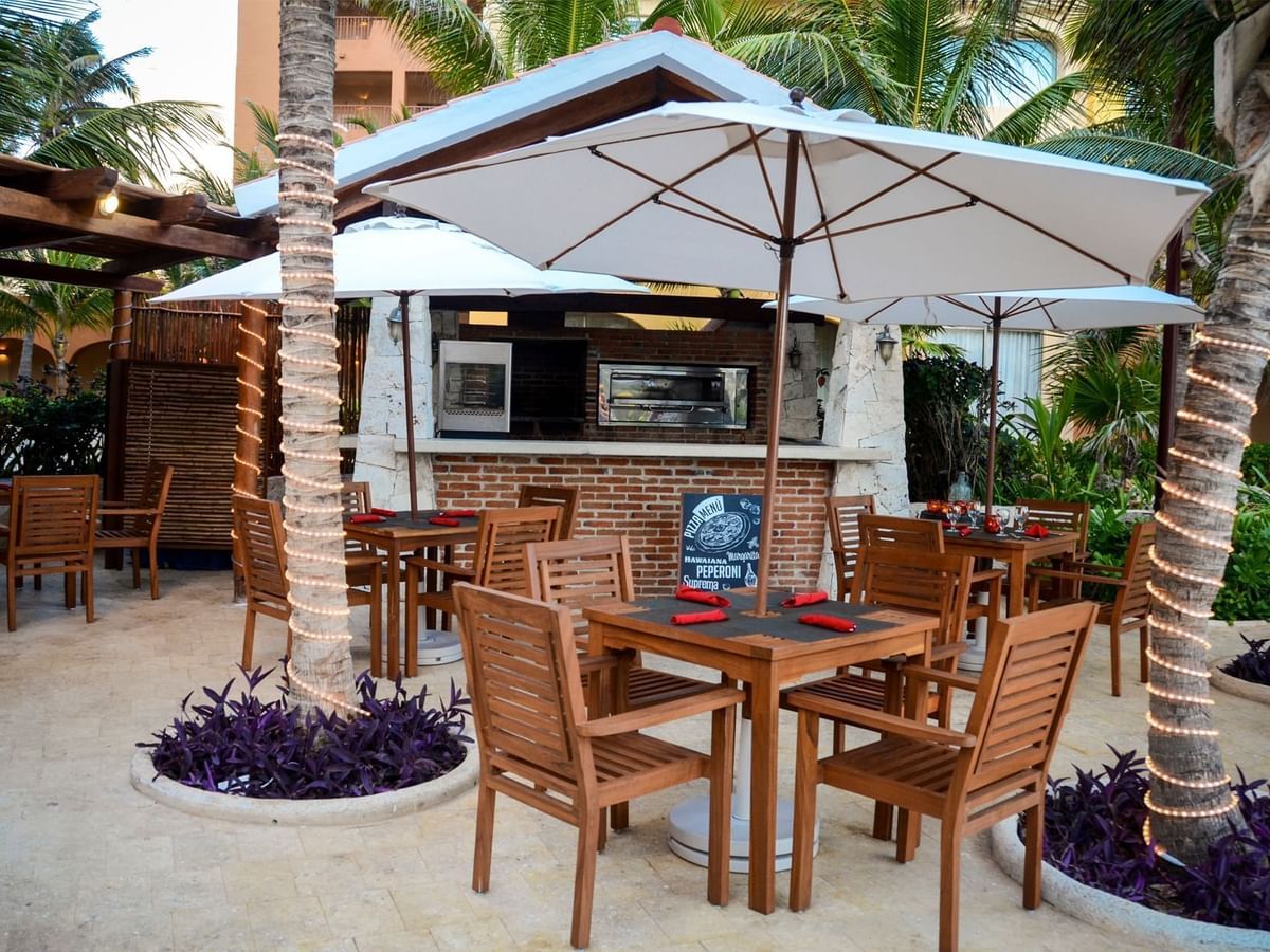 Chairs arranged in pizzeria at Fiesta Americana Hotels