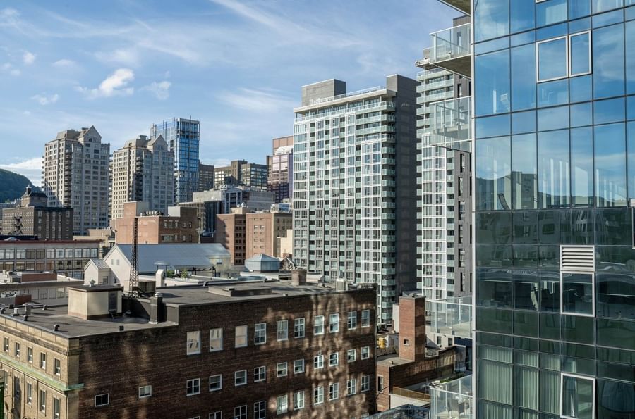 Panoramic view of downtown Montreal from a Junior Balcony Suite balcony at Warwick Le Crystal Montreal