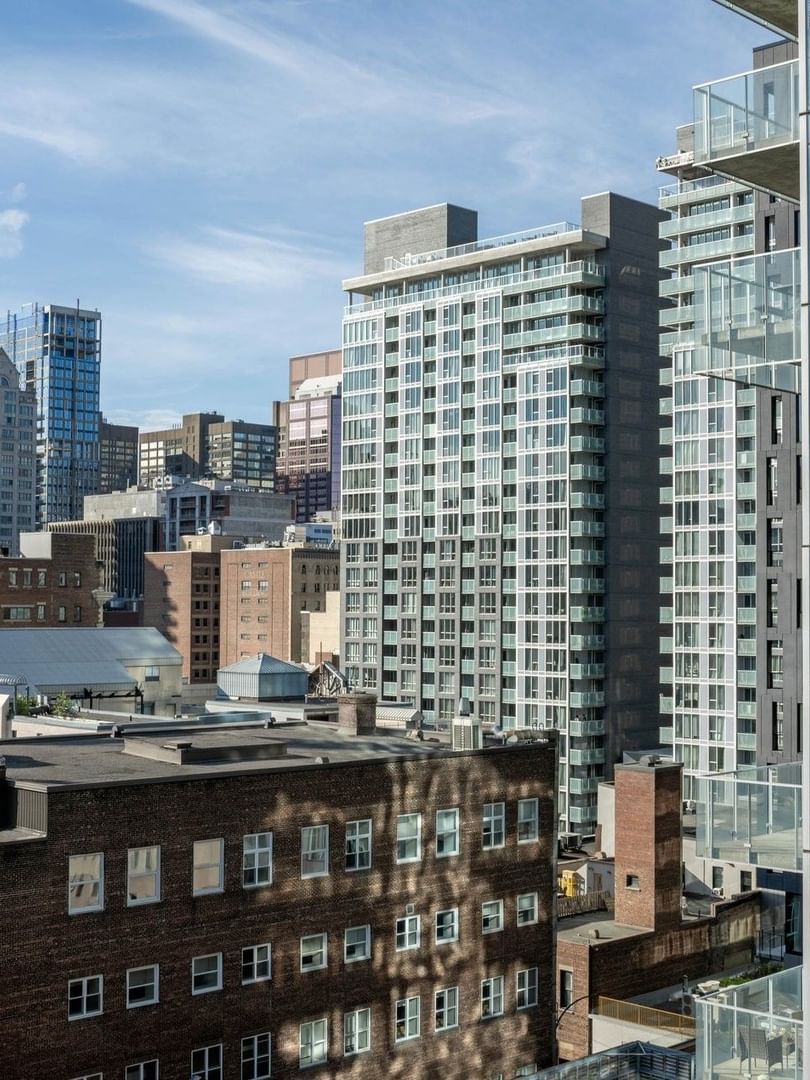 Panoramic view of downtown Montreal from a Junior Balcony Suite balcony at Warwick Le Crystal Montreal