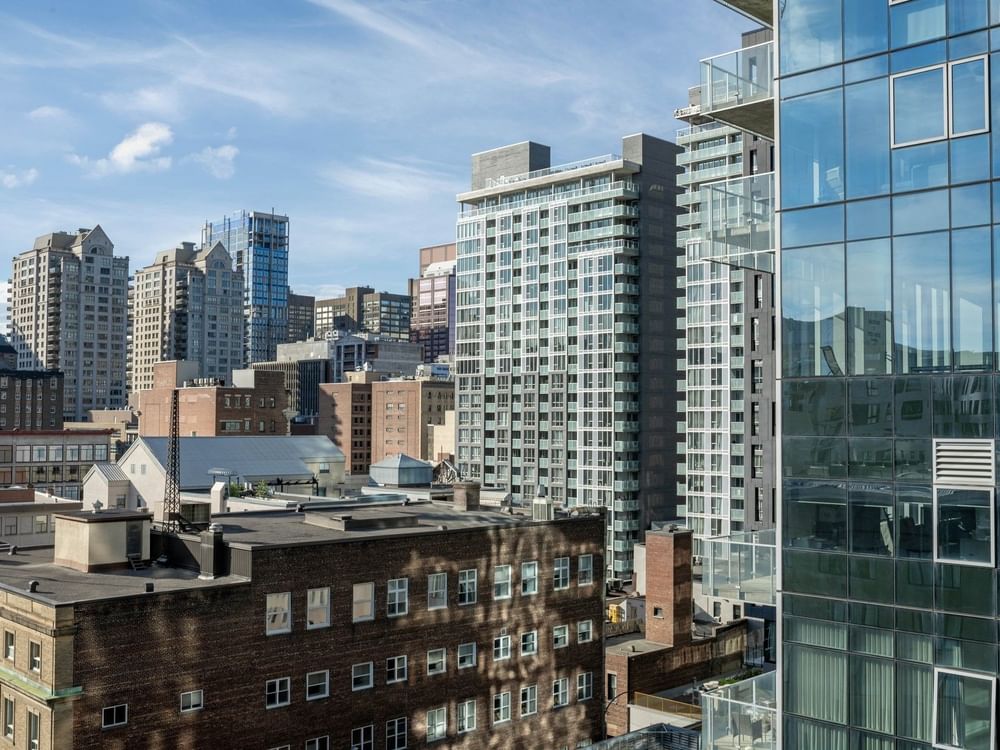 Panoramic view of downtown Montreal from a Junior Balcony Suite balcony at Warwick Le Crystal Montreal