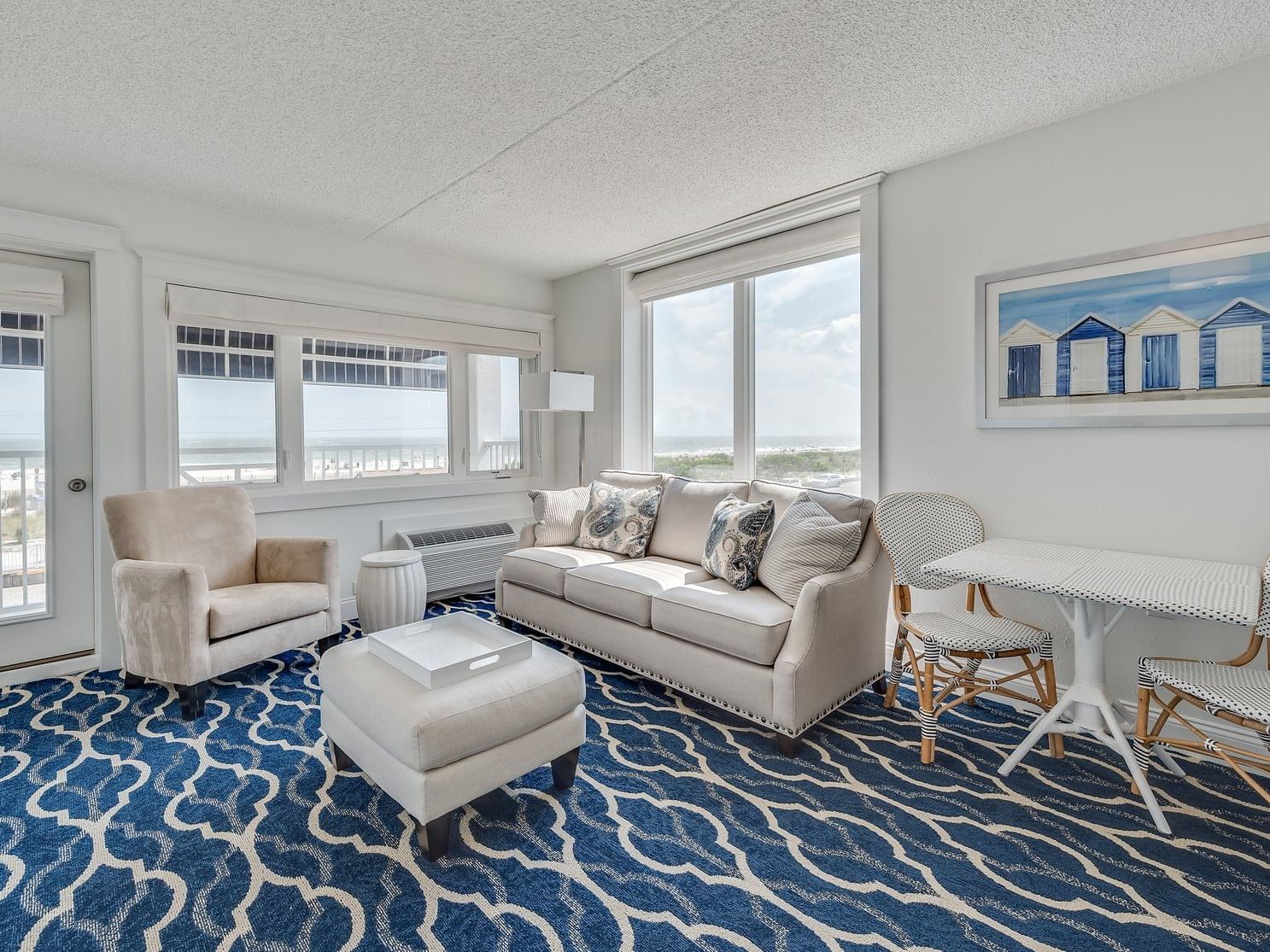 living roomwith light colored sofa and dining table