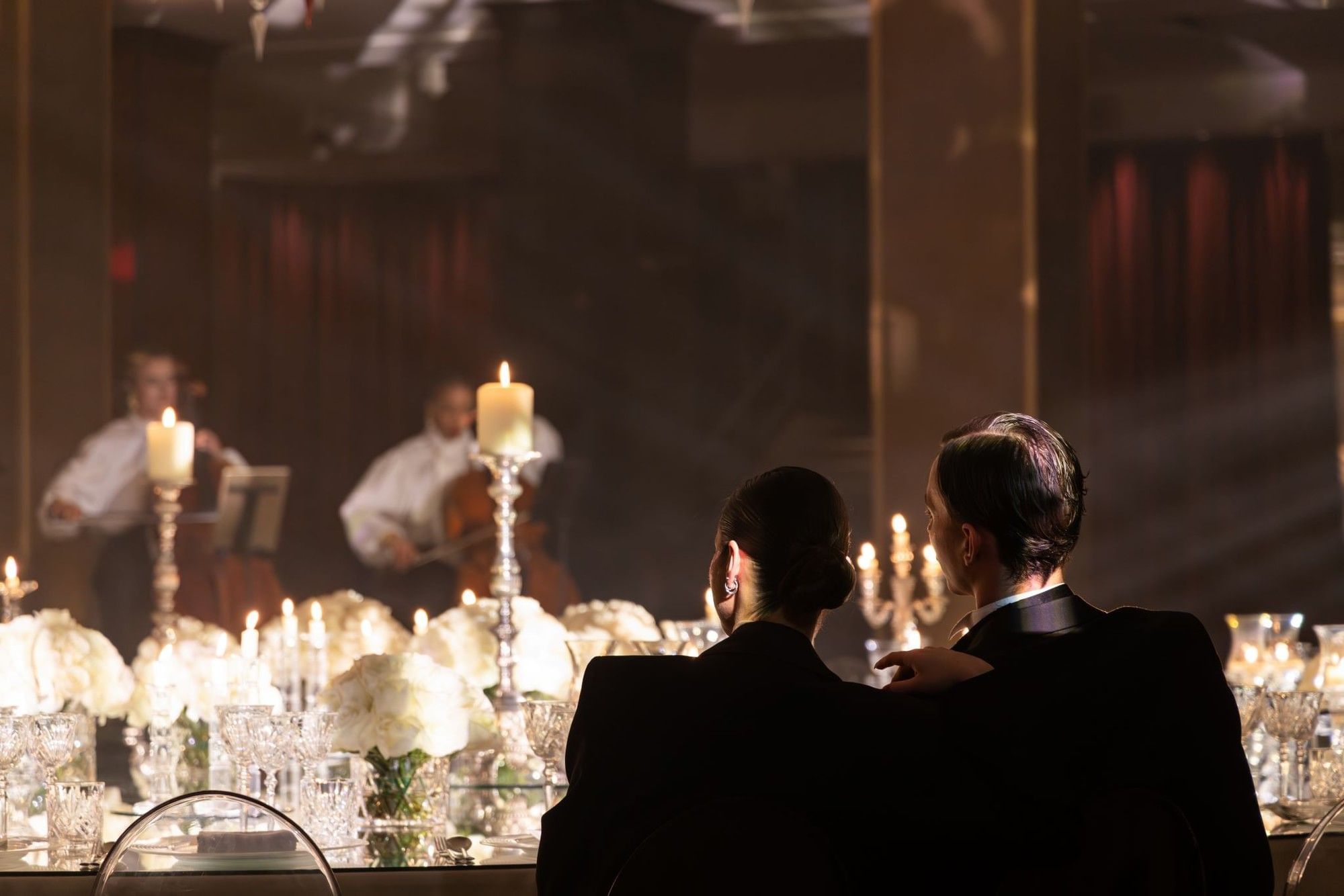 Two guests sitting at a candlelit table at The May Fair Hotel, London